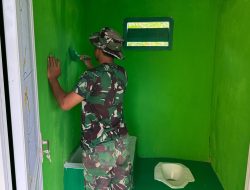 Satgas TMMD Ke-129 Lanjutkan Pengecatan MCK SDN Umbele di Desa Pulau Dua