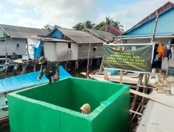 Satgas TMMD Ke-129 Kodim 1311/Morowali Rampungkan Pengecatan Bak Penampungan Air Program Manunggal Air di Desa Umbele